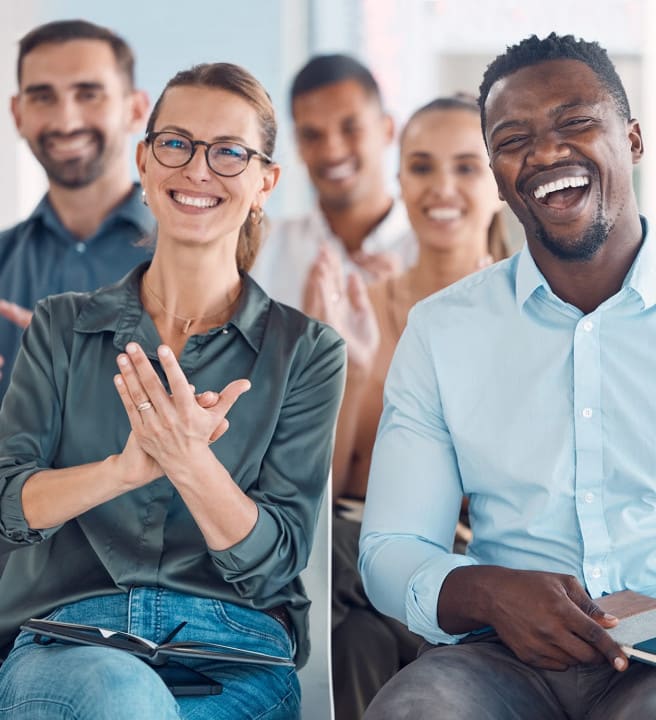 Group of people sat down laughing