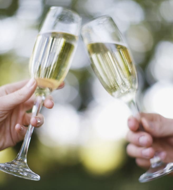 Raising champagne glasses