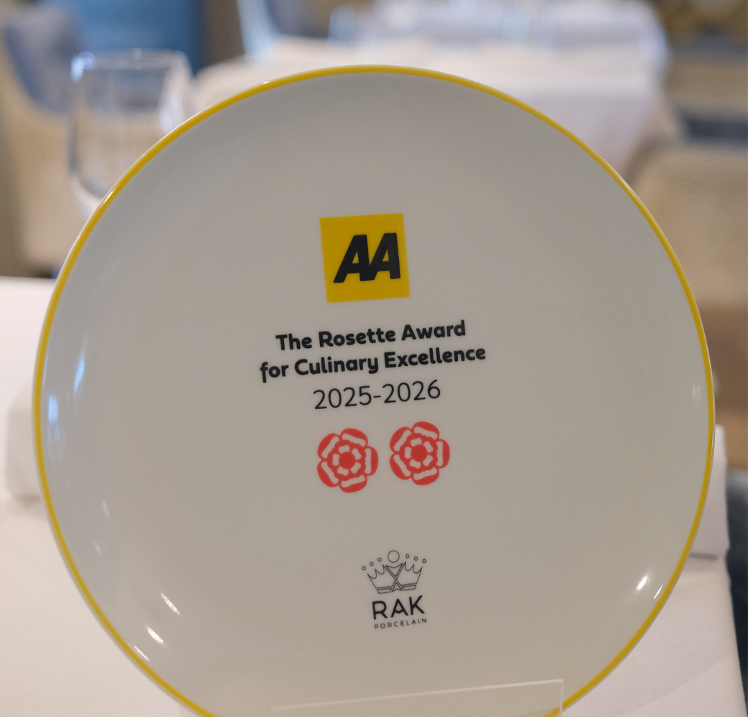 AA Rosette Award for Culinary Excellence plate for 2025-2026 displayed in a restaurant.