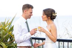 Bride and groom toasting with champagne outdoors