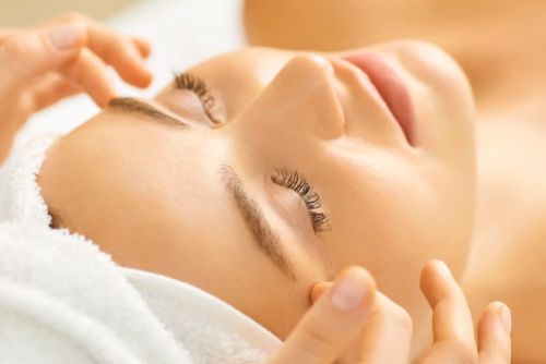 Person receiving a relaxing facial massage