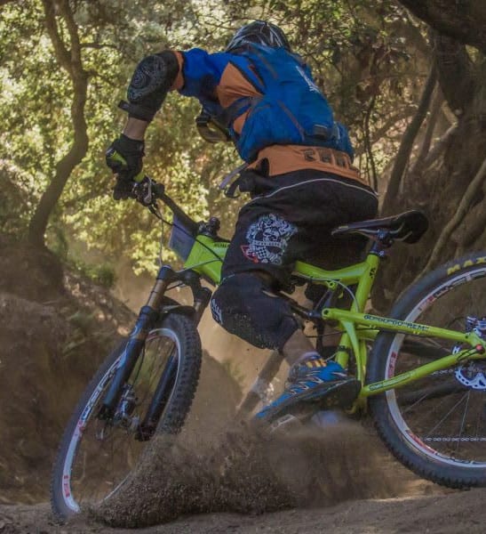 Person mountain biking on a track