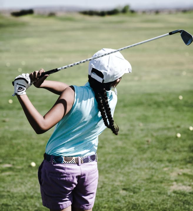 Child playing golf
