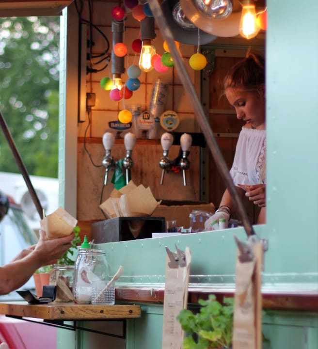Woman working at a food and drink truck