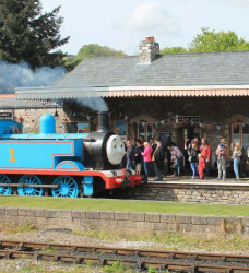 Thomas the tank engine steam train at a train station