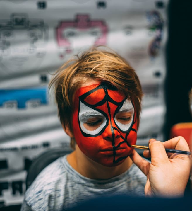 Child with Spiderman face paint