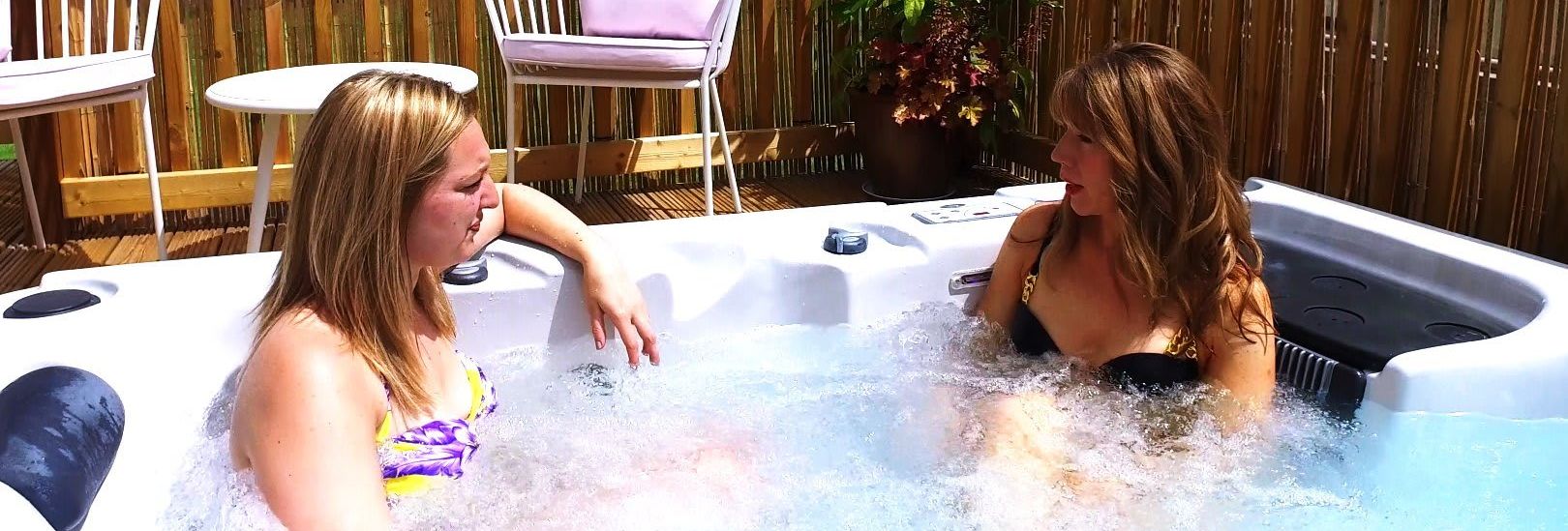 Two women in a holiday home with a hot tub