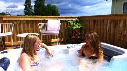 Two women in a holiday home with a hot tub