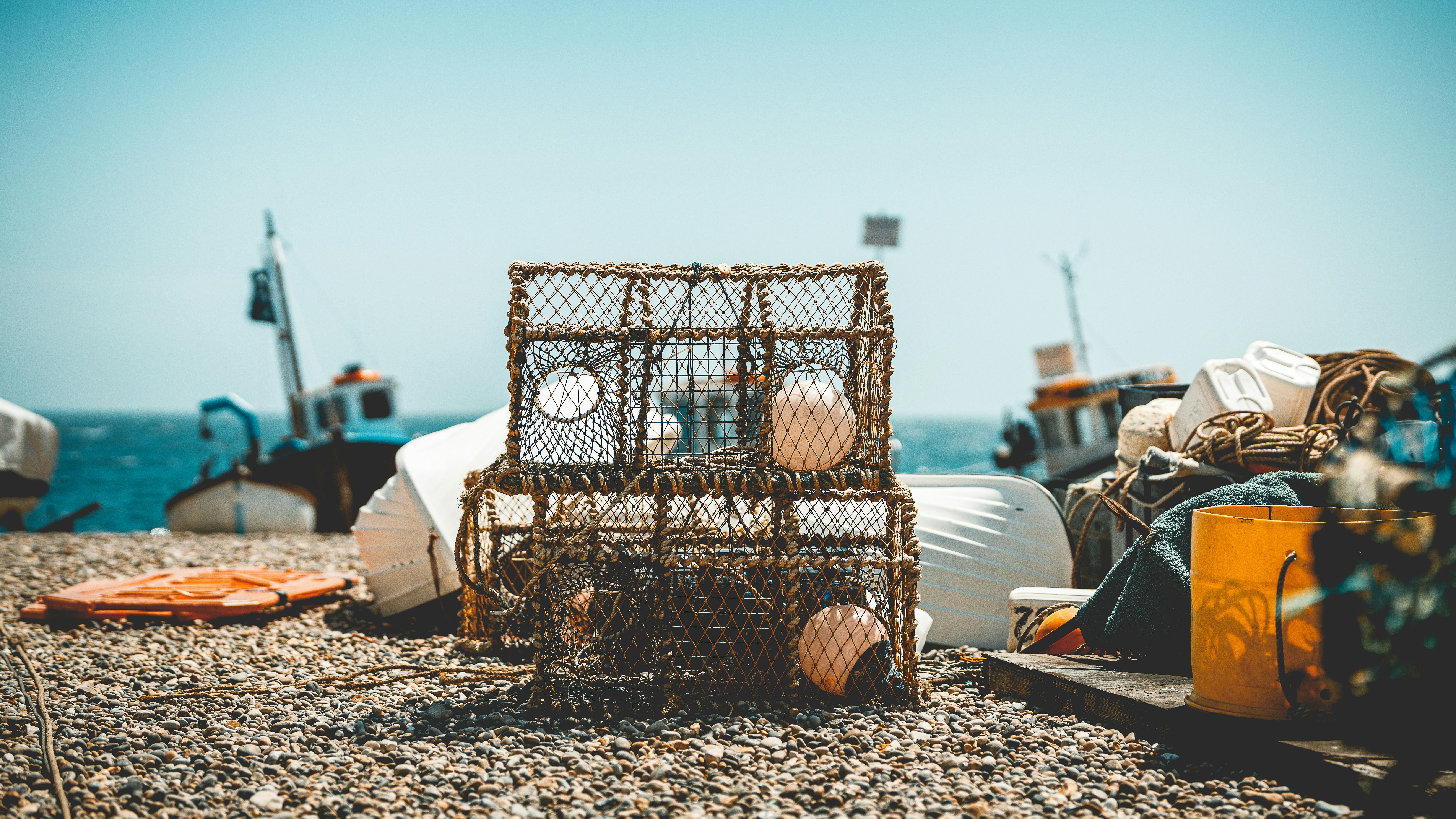 Fishing net in Devon on the beach with the sea behind