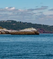 Devon with stone island in the foreground surrounded by the sea