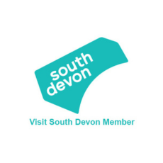 Visit South Devon Member logo with turquoise geometric shape and text