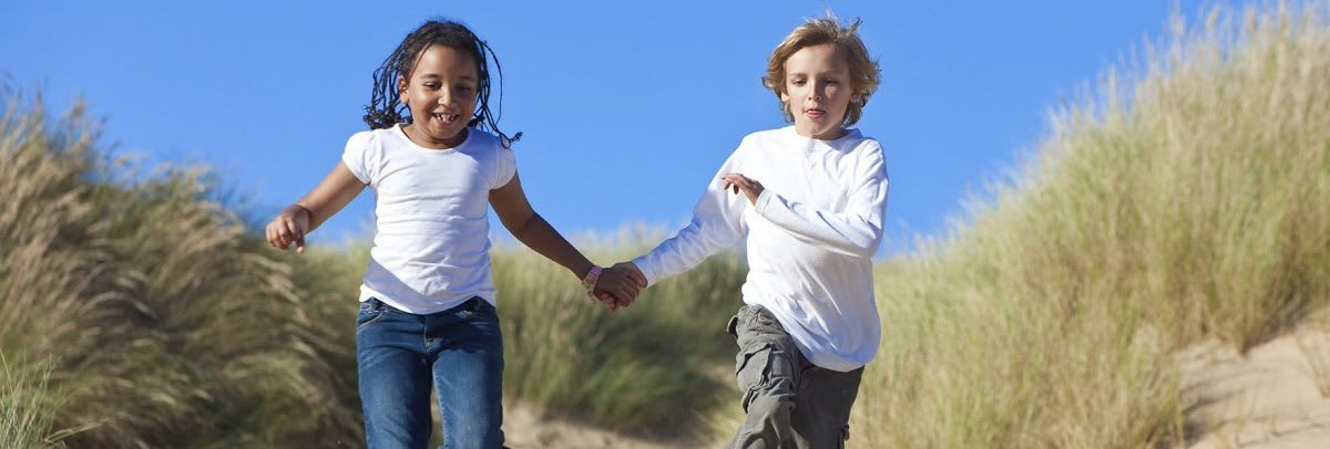 Kids running on the beach