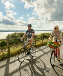 Two people cycling in Devon