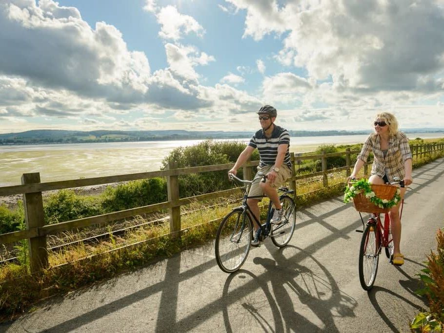 Two people cycling in Devon