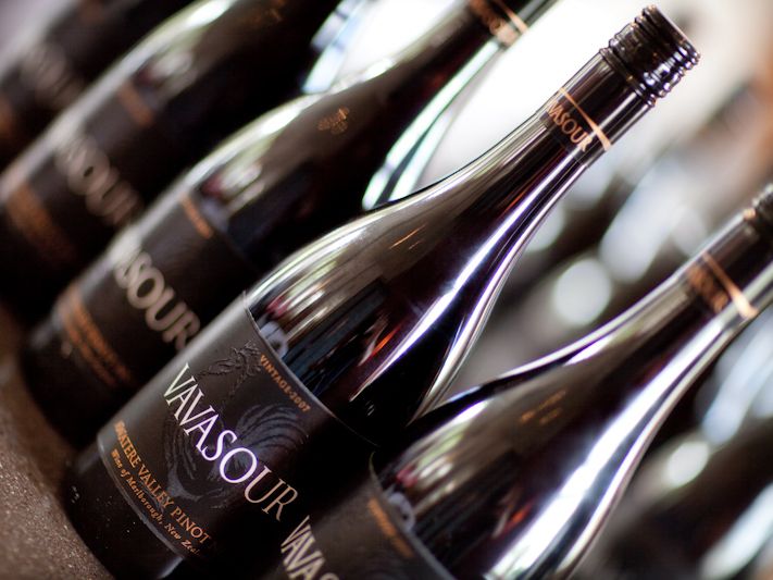Close-up of several Vavasour wine bottles arranged in a row.