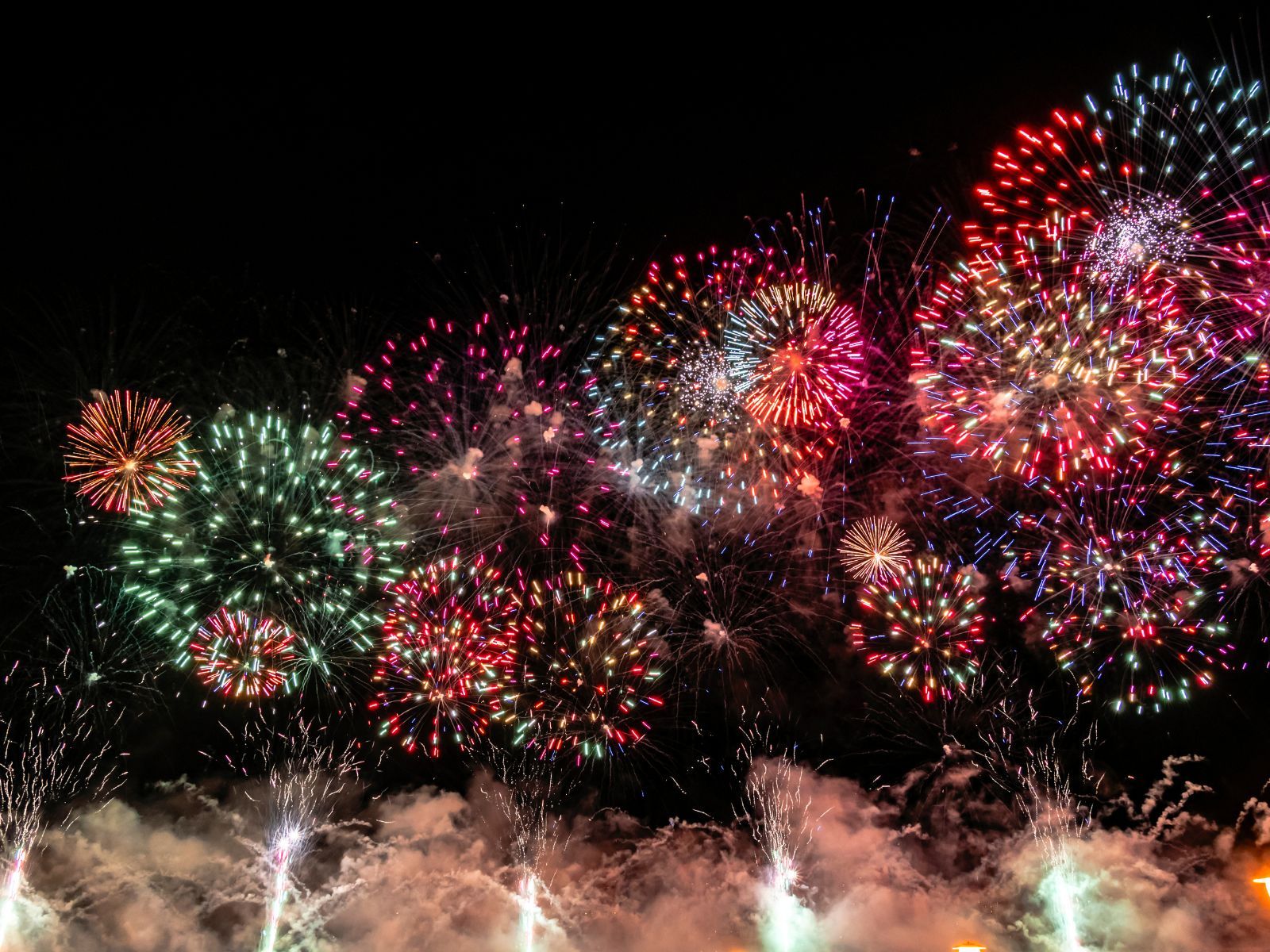 Colorful fireworks exploding in the night sky