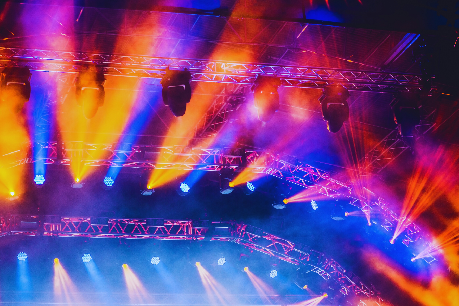 Colorful stage lighting at an outdoor concert