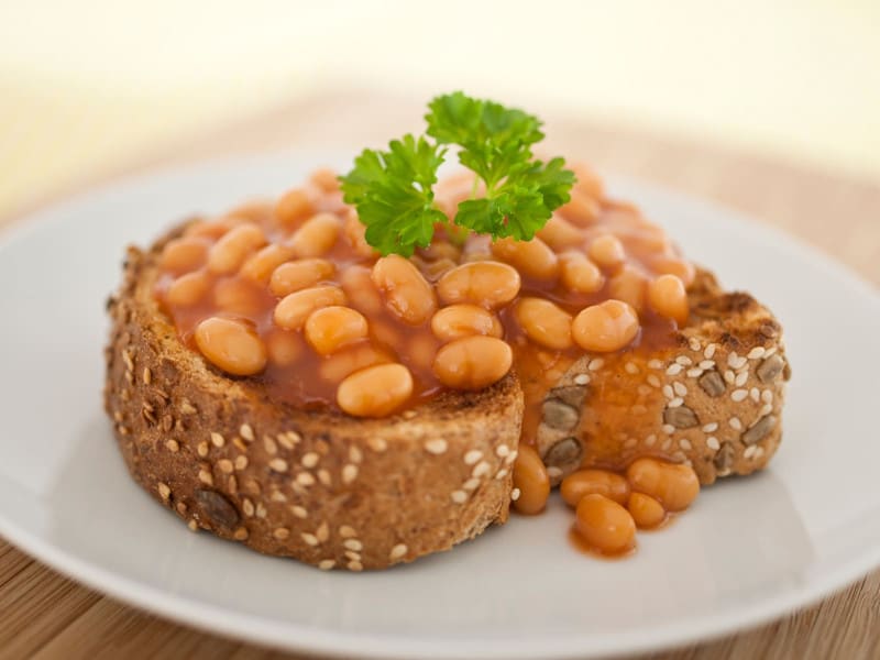 Beans on thick seeded toast with parsley garnish