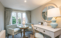 Cosy window nook with seating area and desk