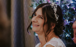 Bride listening to wedding speeches Alice Cunliffe Photography