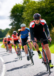 Line of cyclists wearing cycling gear
