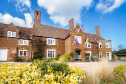 Exterior of Heacham Manor Hotel Entrance with Flags (2)