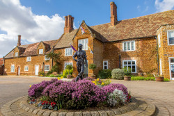 Wide Shot of Hotel Entrance with Golfer