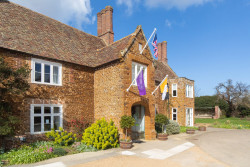 Exterior of Heacham Manor Hotel Entrance with Flags