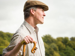 Norfolk Farmer holding a stick