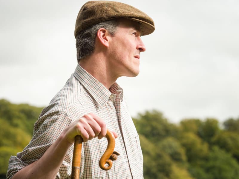 Norfolk Farmer holding a stick