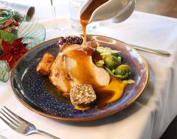 Festive Turkey Diner with trimming and gravy poured