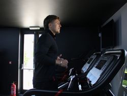 Man Running on Treadmill in The Wellness Centre