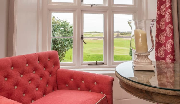 manor-four-poster-armchair-and-window