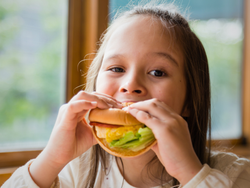 Young Girl Eating a Burger