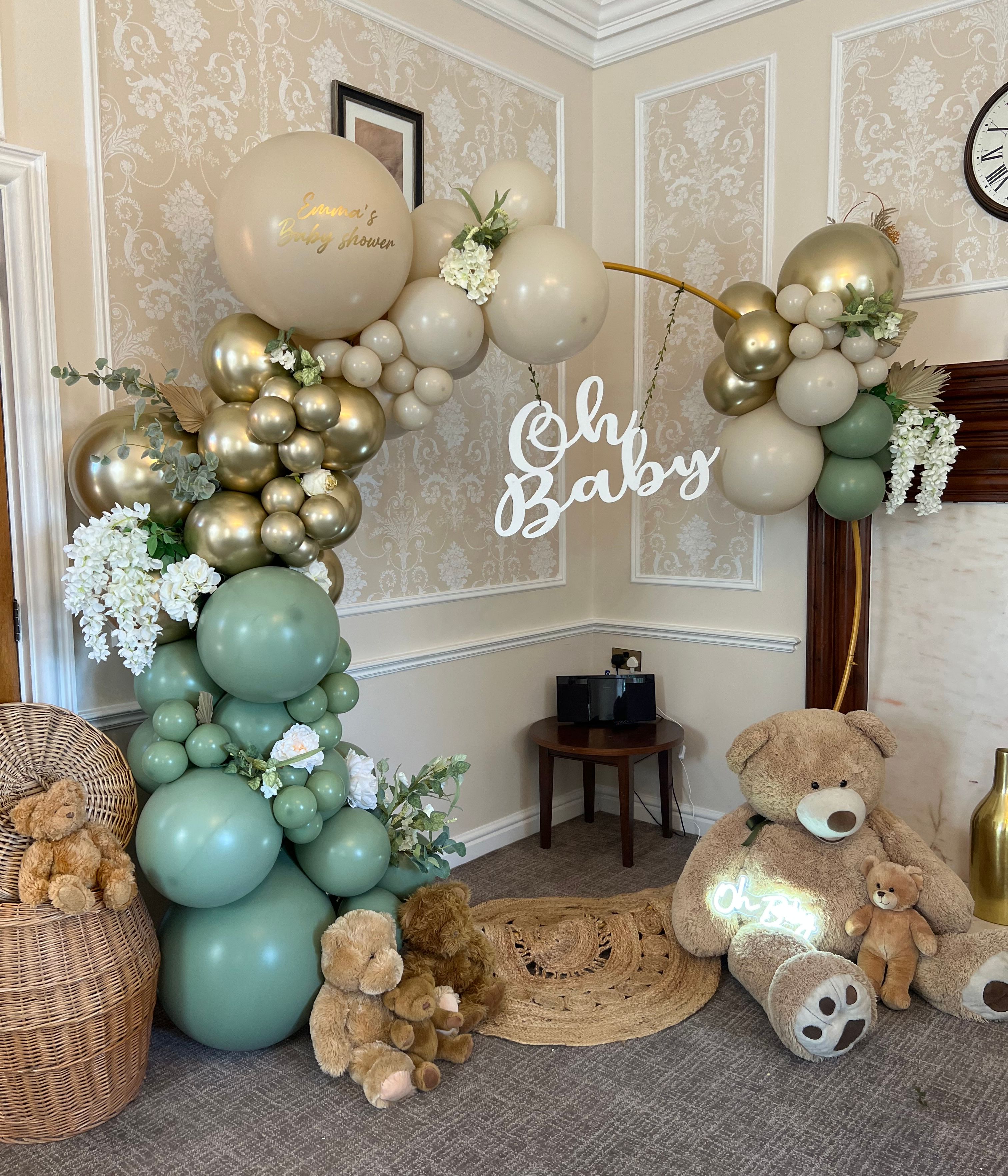 Balloon arch and teddy bear decorations for a baby shower