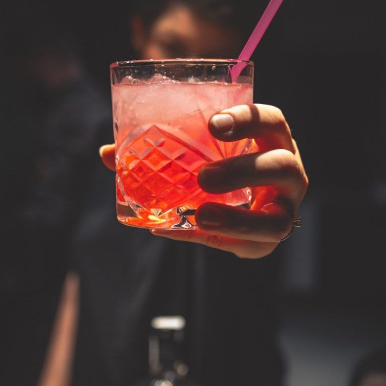 A man holding a cocktail.