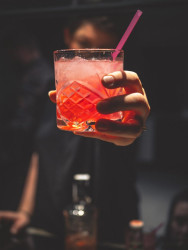 A man holding a cocktail.