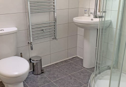 A bathroom in The Wagon Shed self catering barn.