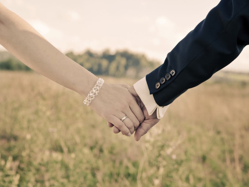 Two people holding hands.