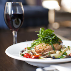 Dinner and wine on a table.