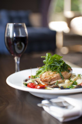 Dinner and wine on a table.