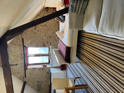Bedroom and living area in The Saddlery