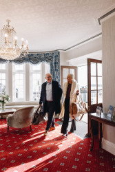 Guests walking through hotel entrance