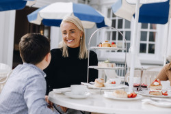 Family enjoying afternoon tea on terrace