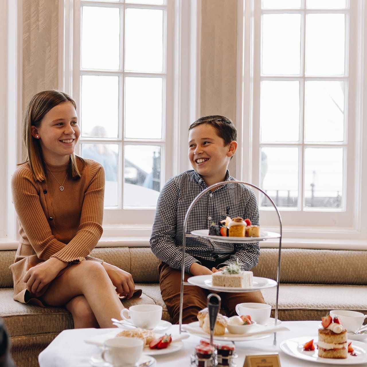 Family enjoying afternoon tea on terrace