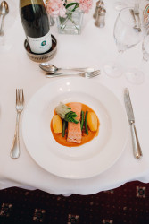 Fish main course with bottle of wine