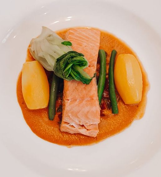 Fish main course with bottle of wine