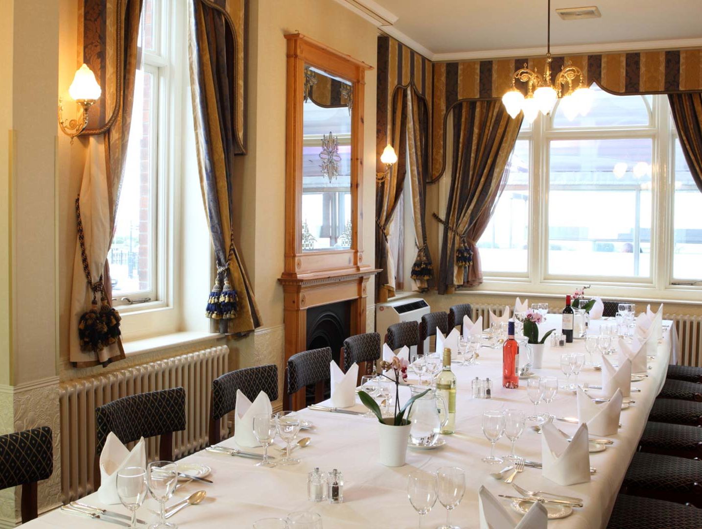 Elegant conference dining room with a long table set for a formal meal