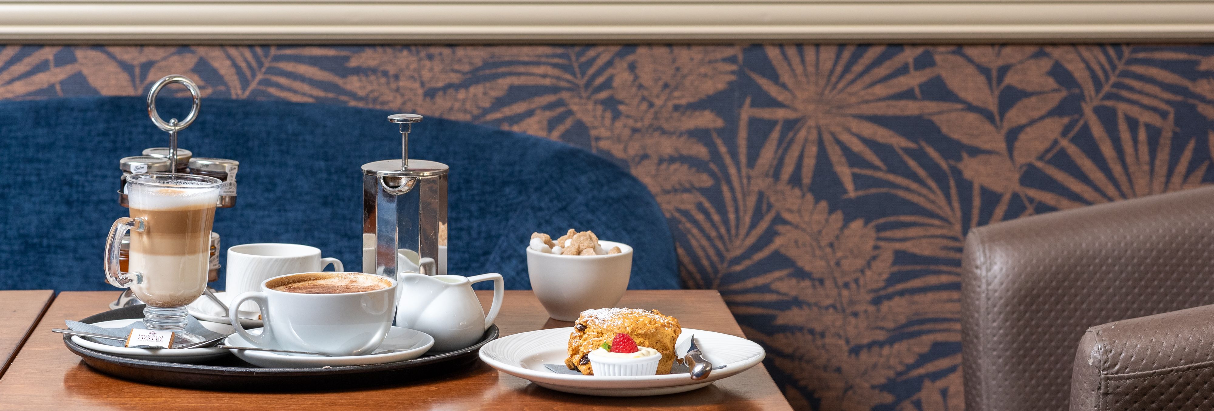 Coffee and scones on the table at Bar Fizz in Imperial Hotel