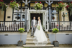 Bride and groom outside the hotel entrance